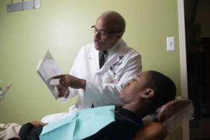 Doctor Reviewing Medical Diagram With Patient