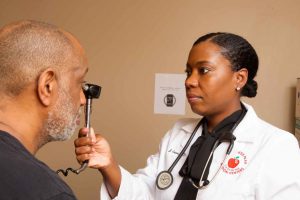 Doctor Inspecting Patient's Eyes