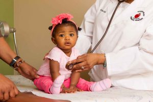 Doctor Checking Baby's Heartbeat