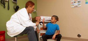 Doctor Working With Child